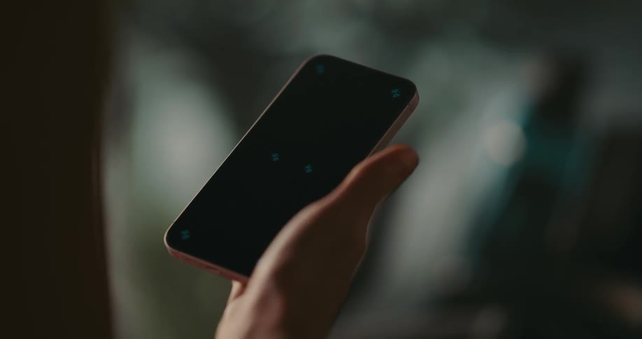 Womans hand uses smartphone