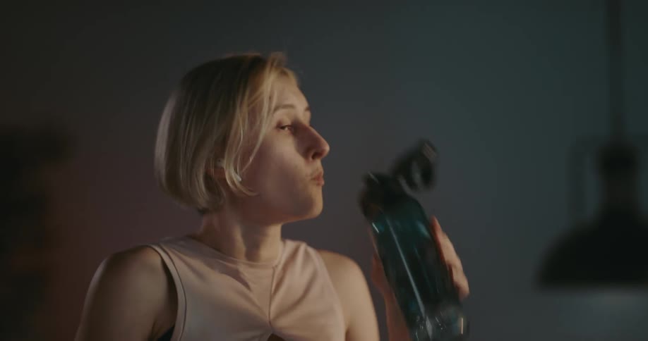 A young woman is working out in the middle of the day time