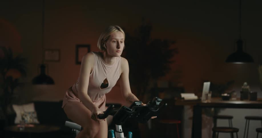 A young woman is working out in the middle of the day