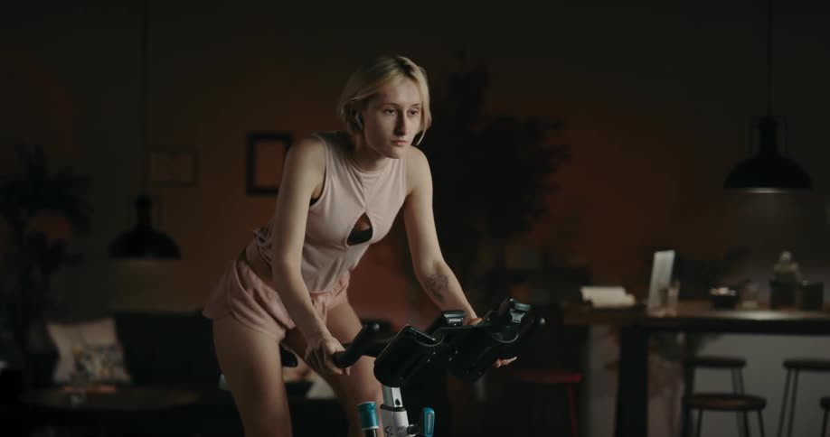 A young woman is working out in the middle of the day