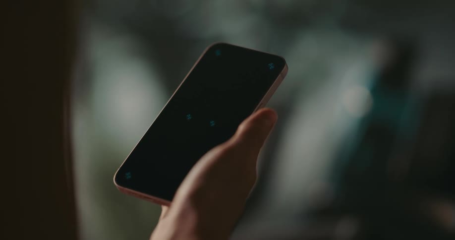 Close up of hand holding smartphone