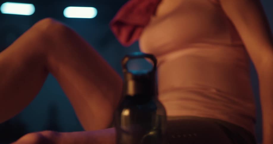 A woman with a water bottle after working out