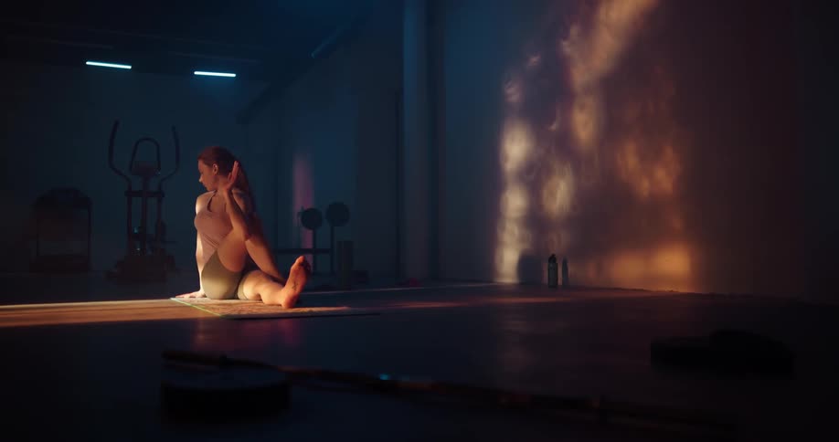 A woman is stretching and doing yoga
