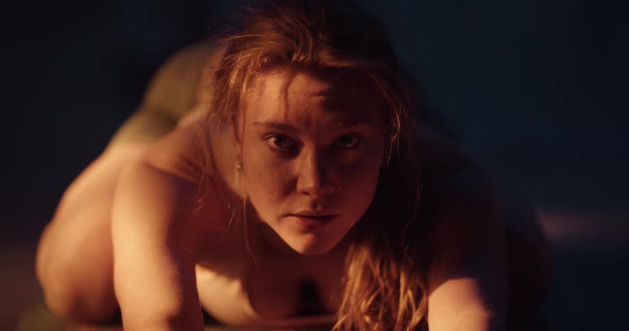 Close up view of a woman stretching indoors