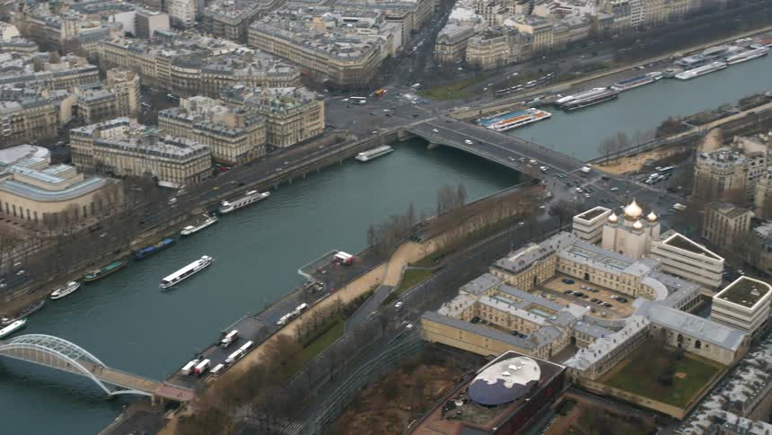 Aerial view of a large river through a city