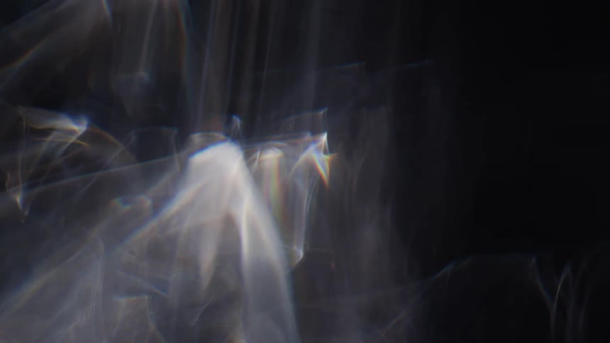 Abstract footage of bright lights and smoke moving