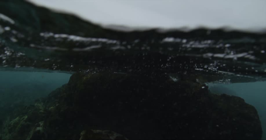 Large rock underwater on the coast