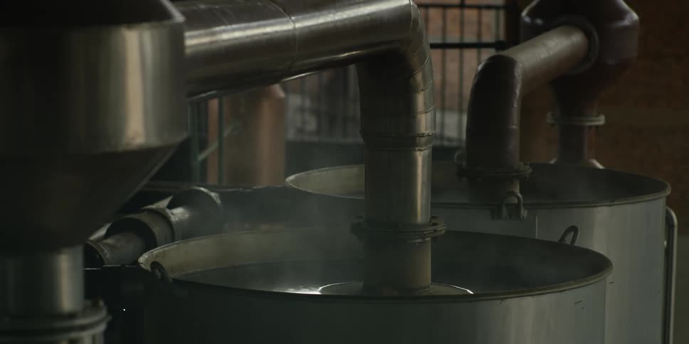 Pipes go into the liquid in the containers