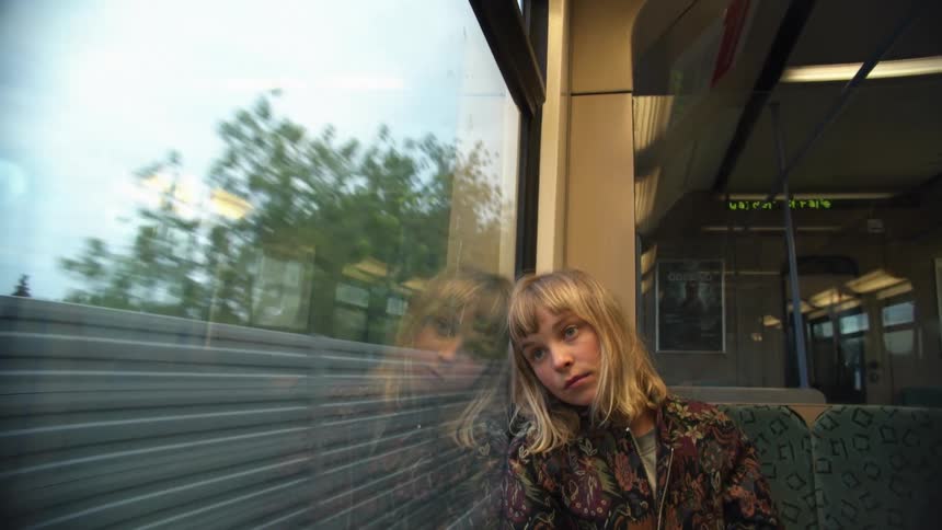 A woman is riding in the train