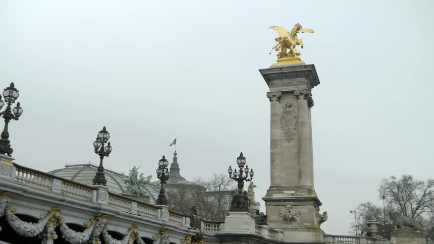 Golden statues on a pillar