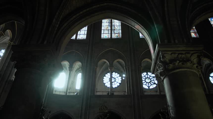 Sunlight streaming through the stained-glass windows of a cathedral