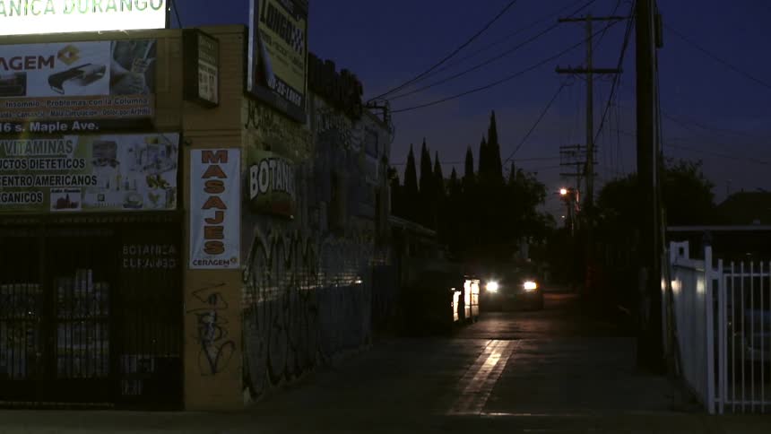 A car drives into an alley