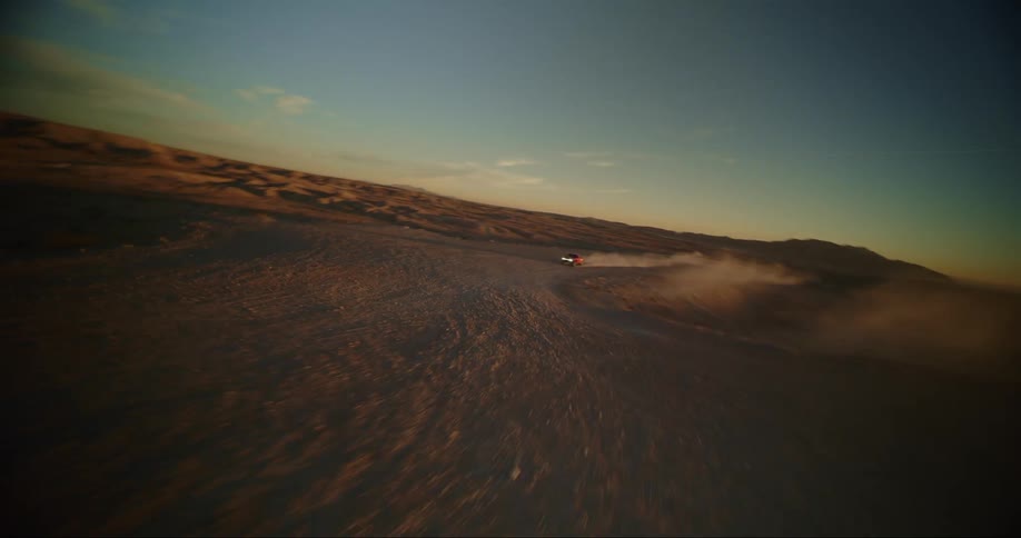 FPV - Wide countering shot of baja truck in desert
