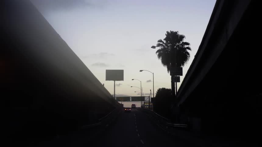Cars are traveling out of a tunnel