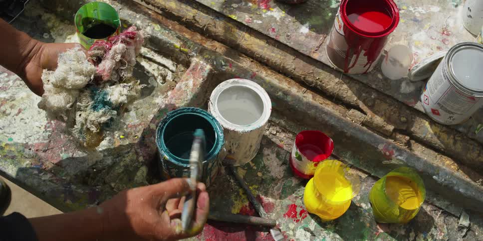A person is mixing paints