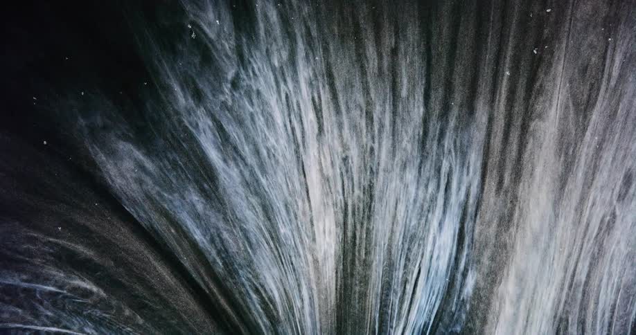 Water spreads out as it exploes upward