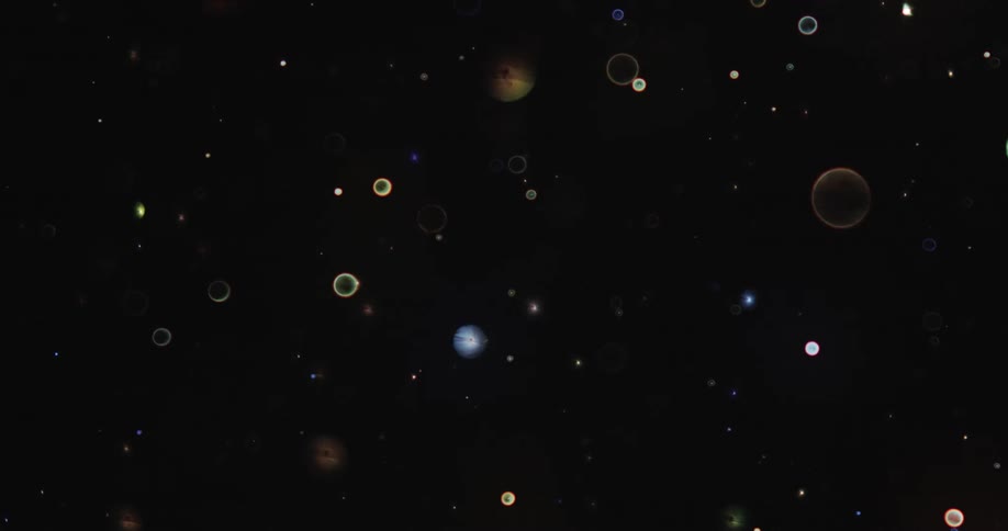 Orbs of colorful lights flashing in the darkness