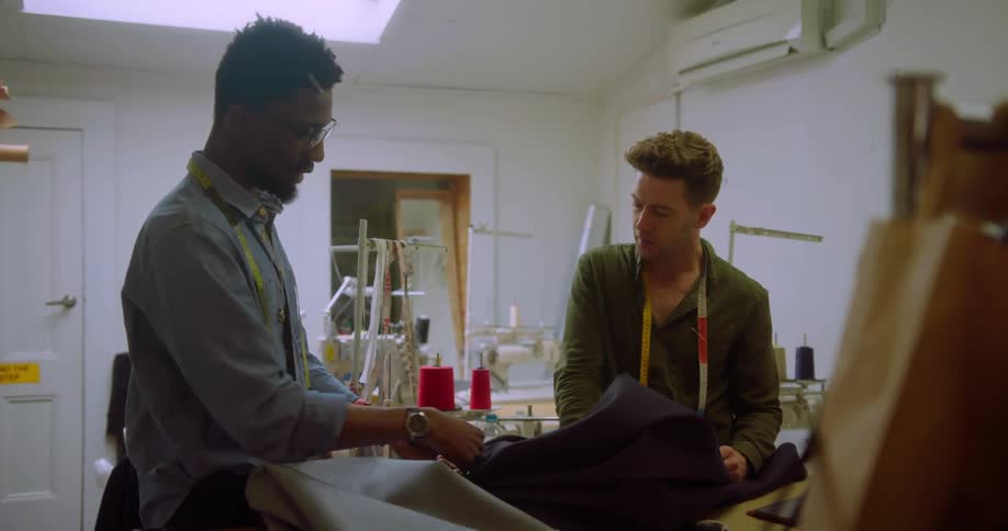 Two fashion designers talk about a piece of fabric