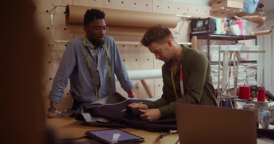 Two men talking about a pair of pants