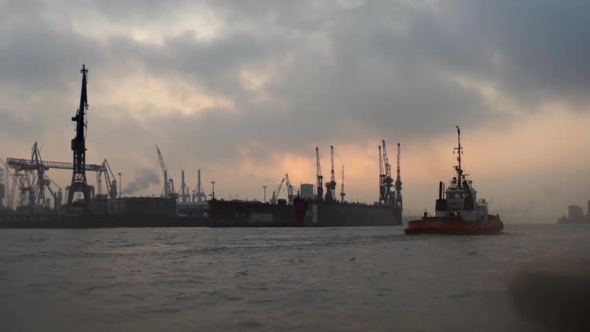 A boat is sailing on a cloudy day