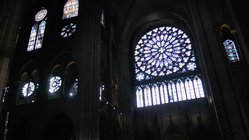Daylight shines through the stained glass windows