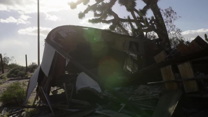 The sun shines on a destroyed building