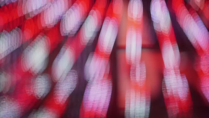 Blurry red and white lights streaming