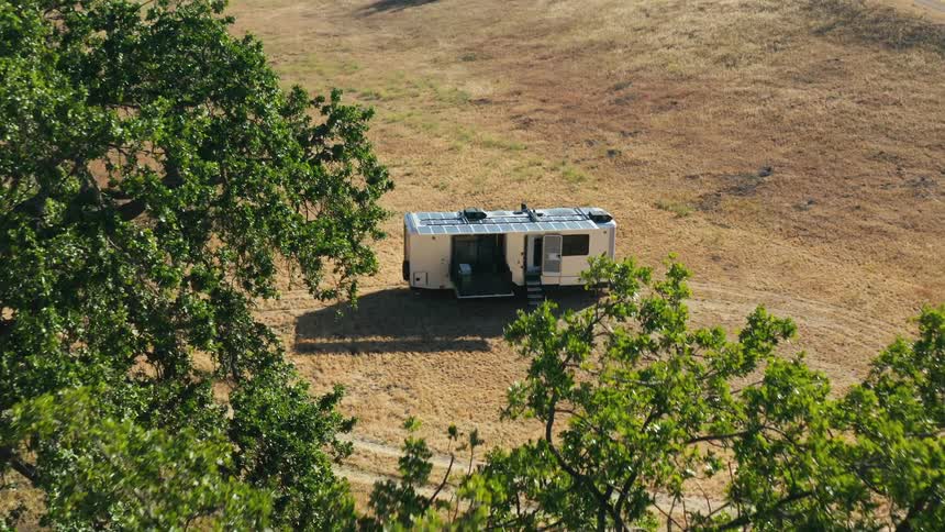 A trailer set up in an open field
