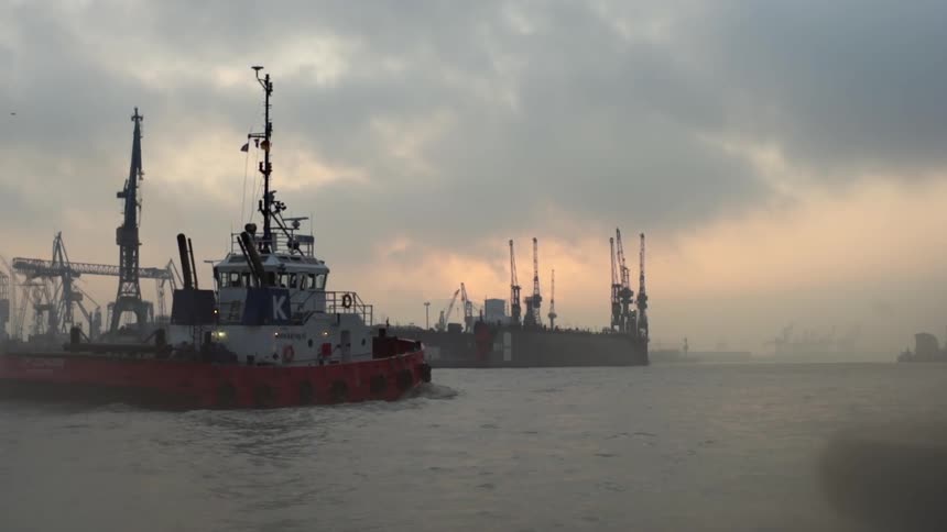 Fishing boat traveling across body of water