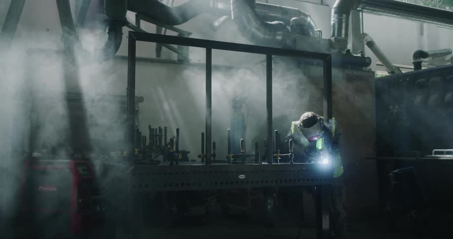 A man is welding in the factory