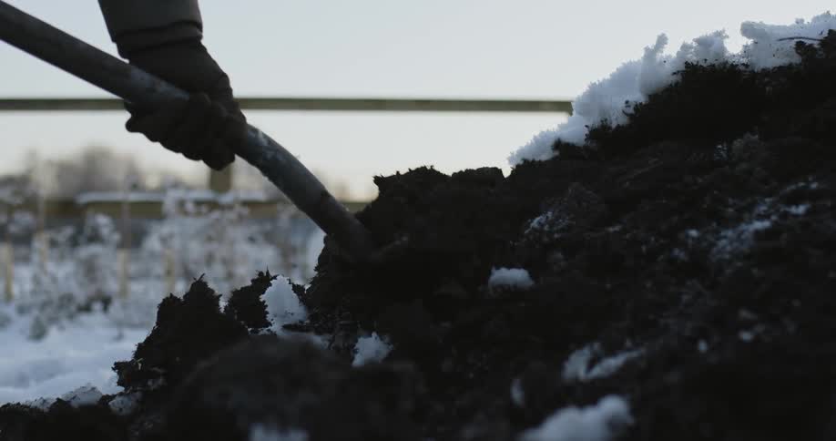 A person is digging up the soil