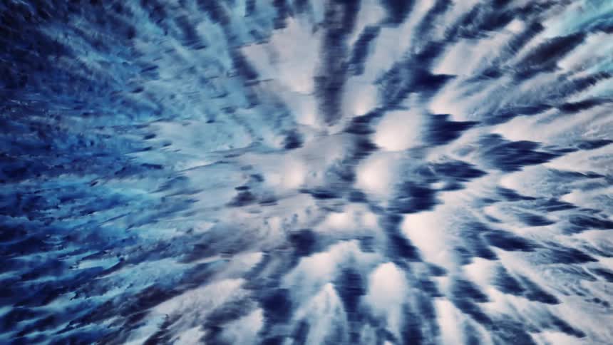 Blue spikes change from light to dark as they move left and right