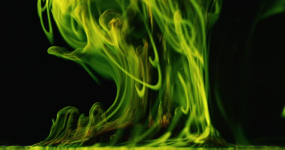 Shades of green smoke flowing upwards on a black background