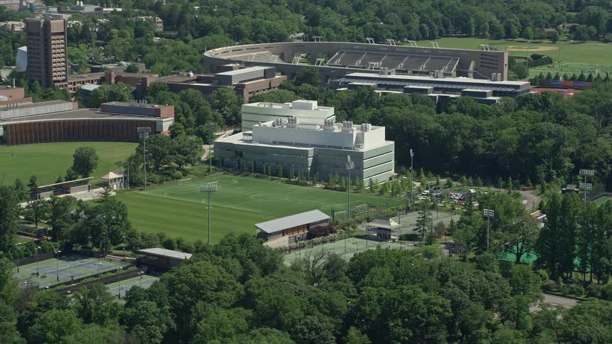 A stunning aerial view of the sport facilities and stadium at Princeton University including Roberts Stadium and Peretsman Scully Hall capturing the perfect summer day in New Jersey