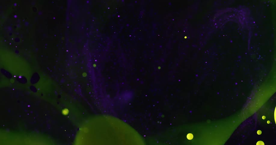 Blobs of green in a space of purple