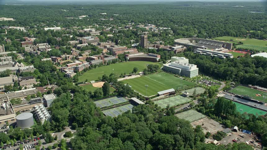 Aerial footage of Roberts Stadium and sports fields on Princeton University campus in New Jersey on a sunny day