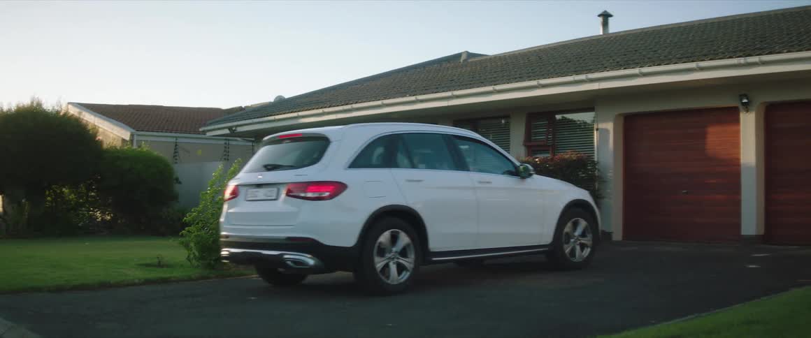 A vehicle pulls into the driveway of a home