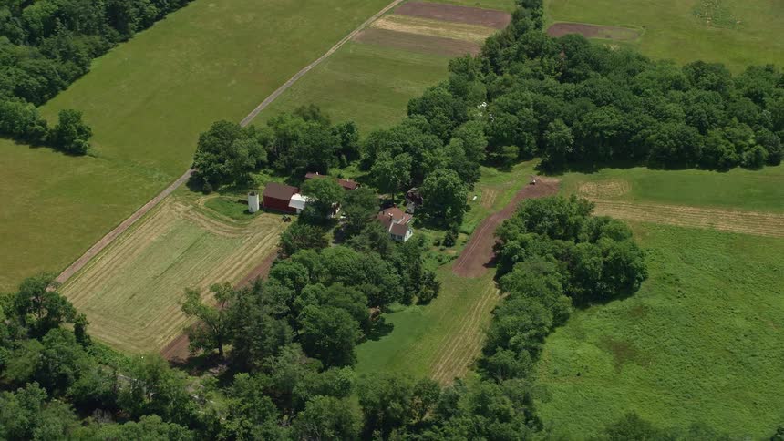 Aerial footage shows a rustic barn in Belle Mead New Jersey surrounded by lush farmland and residential neighborhoods