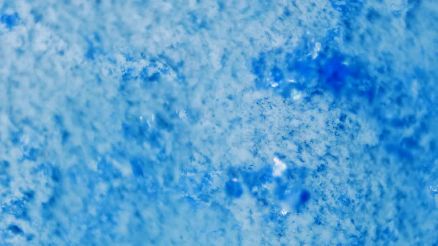 Textured blue liquid surface