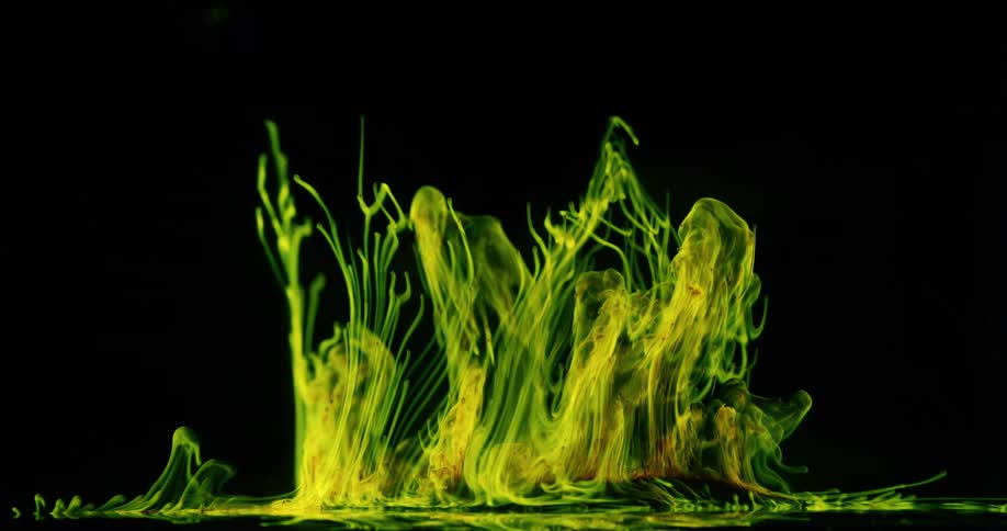Green smoke transforms ripples and rise on a black background