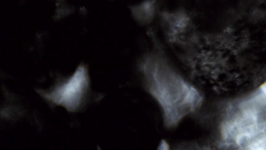 Liquid ripples across shadows and light