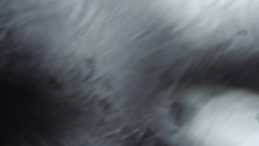 Liquid ripples with particles light and shadows