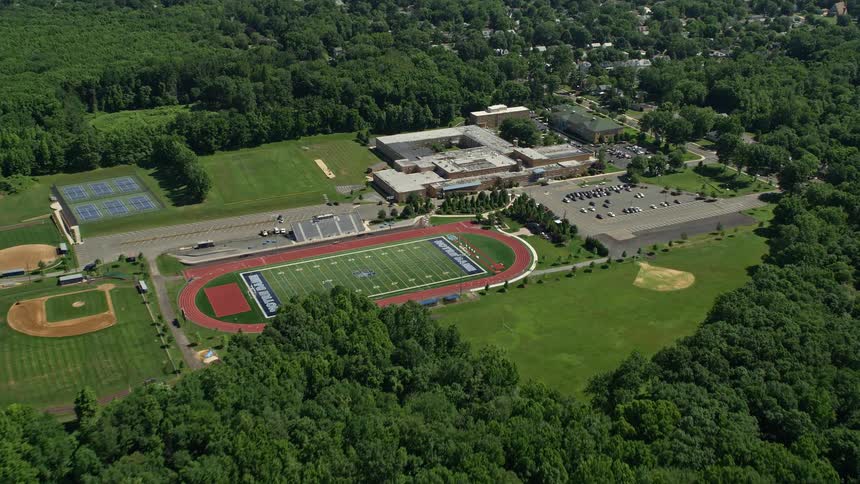 A birds eye view of Notre Dame High Schools football field and surrounding buildings on a sunny day in Lawrence Township New Jersey