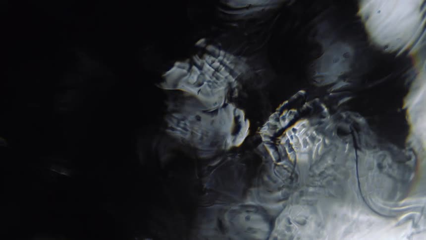 Liquid flows over reflected circles of light