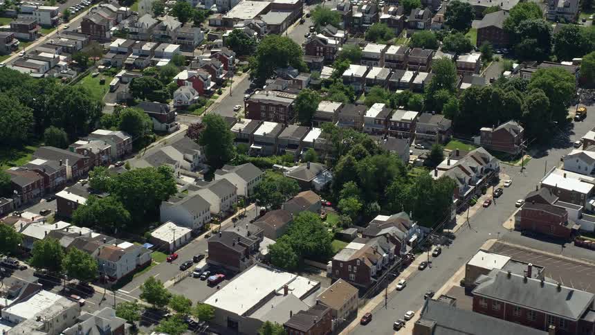 A breathtaking aerial view of row houses and apartment buildings in the urban residential neighborhoods of Trenton New Jersey on a sunny day