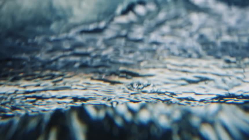 The surface of rippling and flowing water