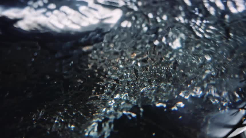 Water swirling around under light