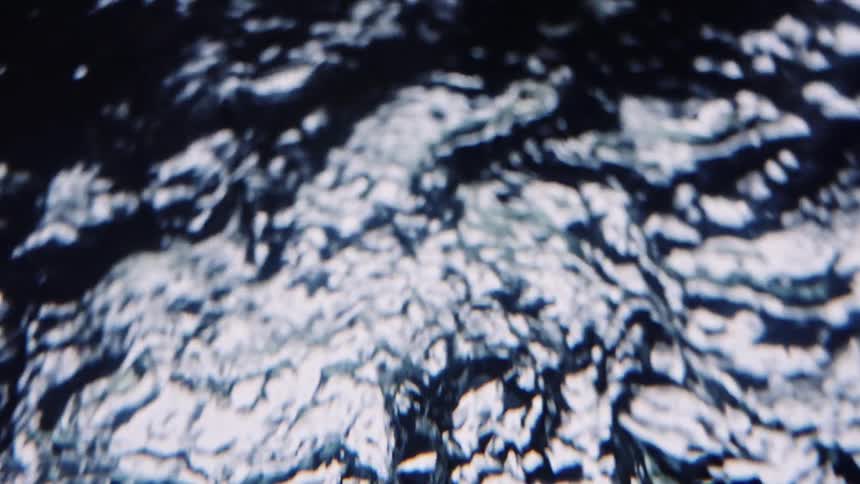 The light reflects on the spinning water