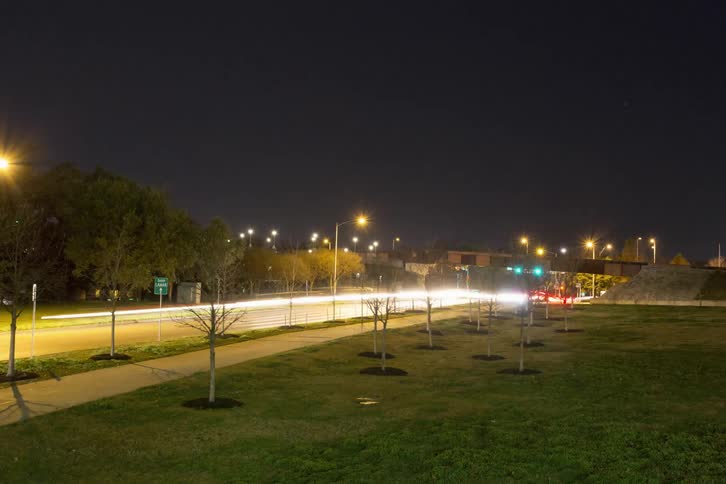 Cars travel down this road at night