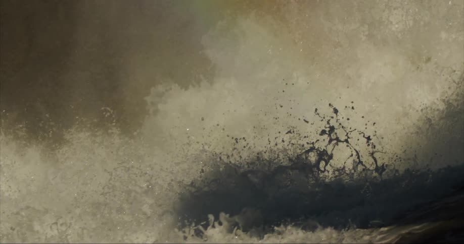 Water exploding as it cascades down a massive waterfall with a rainbow in the background